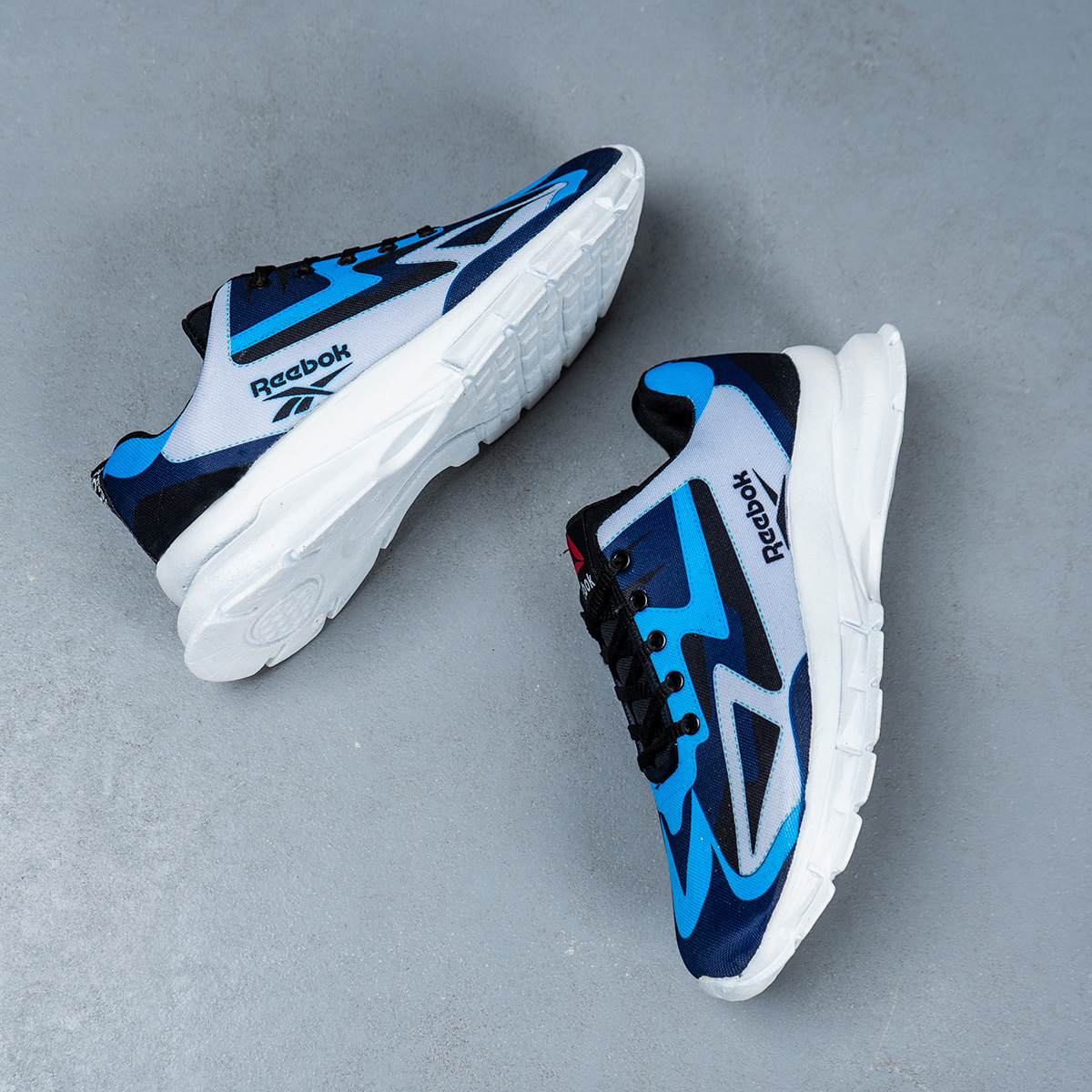 کفش ورزشی ریبوک آبی طوسی مردانه مدل Ervan