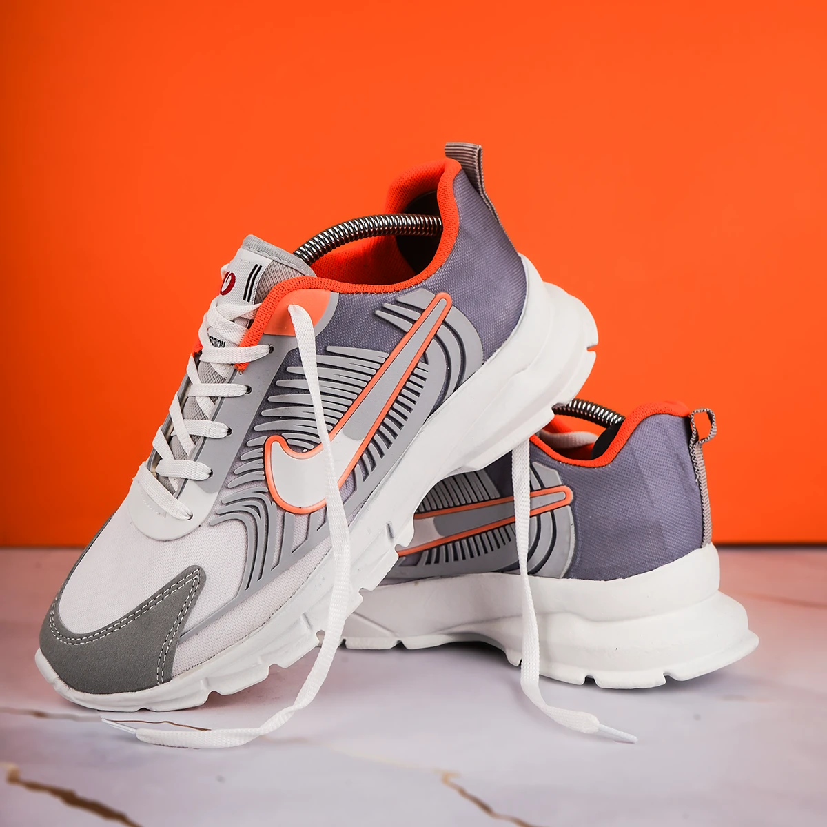 کفش ورزشی مردانه نایک طوسی نارنجی مدل مدل Farhan