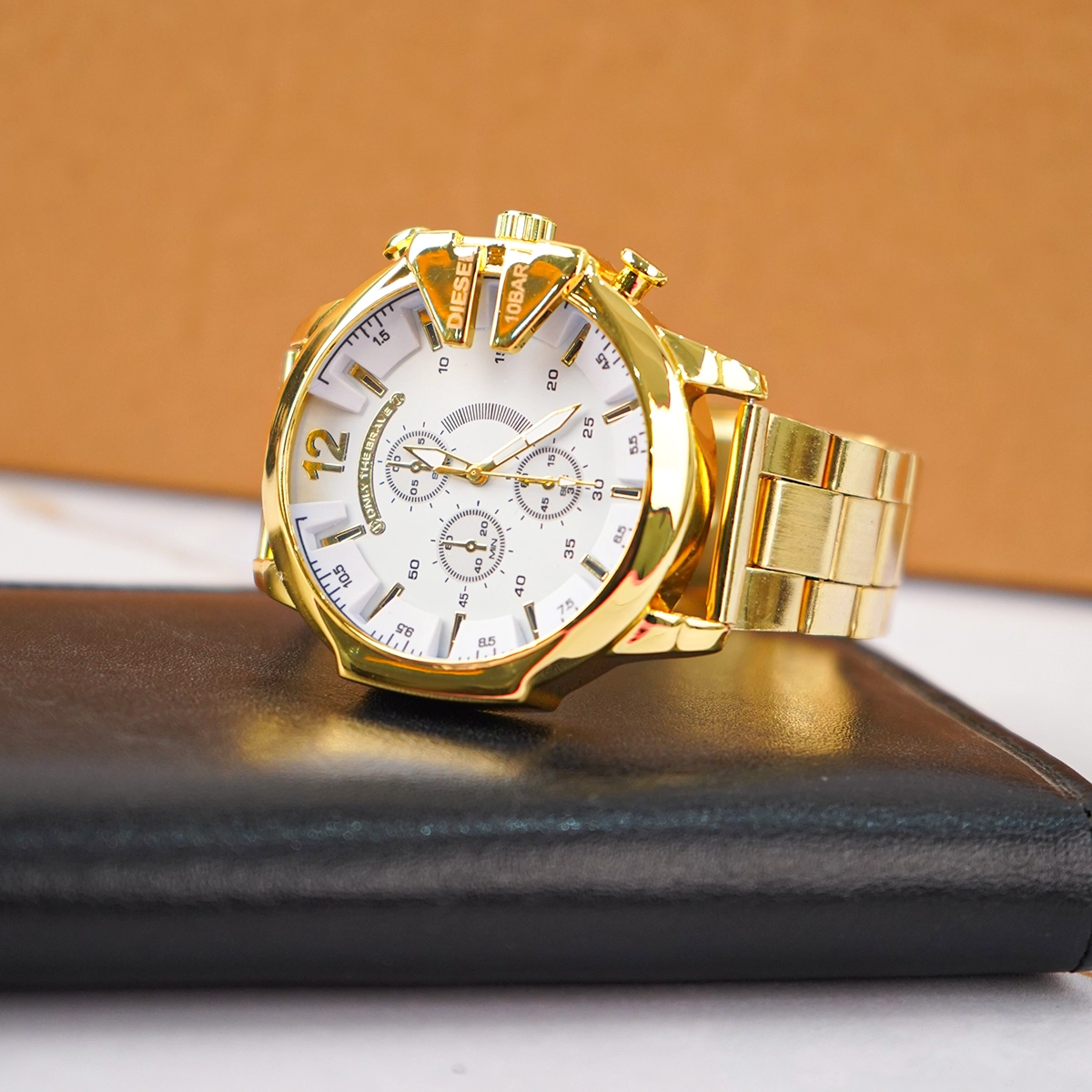 ساعت مچی DIESEL مردانه طلایی صفحه سفید مدل U700