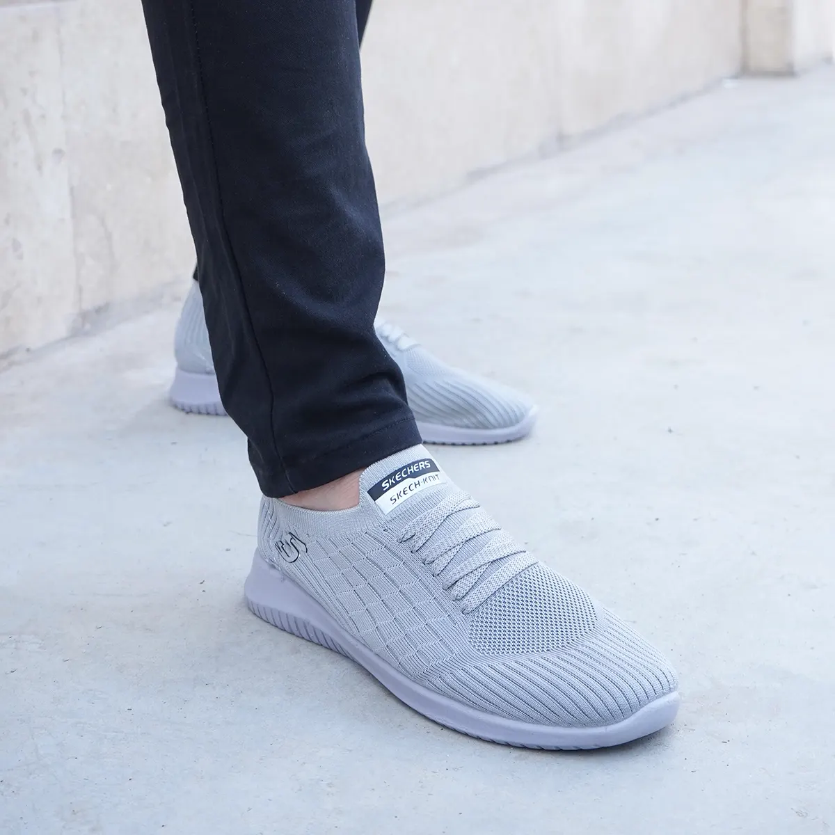 کفش ورزشی اسکیچرز مردانه طوسی مدلE55