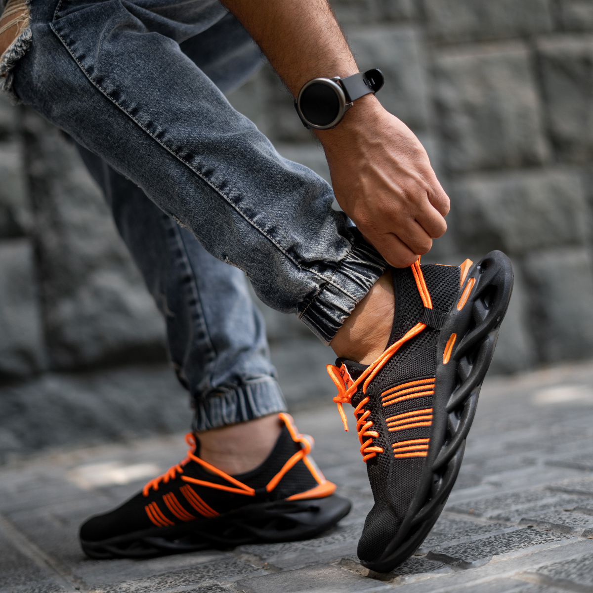 کفش ورزشی مشکی نارنجی مردانه مدل Arisan